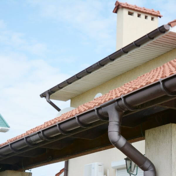 New gutter installation with tiled roofing, featuring a professionally fitted gutter system designed for effective rainwater drainage. New gutter installation with tiled roofing, featuring a professionally fitted gutter system designed for effective rainwater drainage.