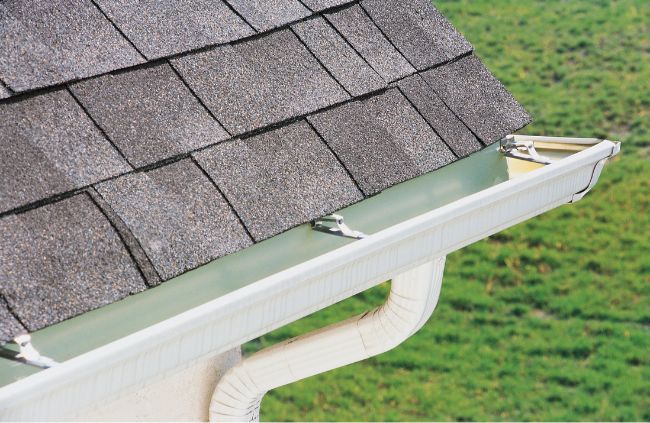New gutter system installation on a residential roof in Western Sydney, showing clean house gutter installation with proper slope. New gutter system installation on a residential roof in Western Sydney, showing clean house gutter installation with proper slope.