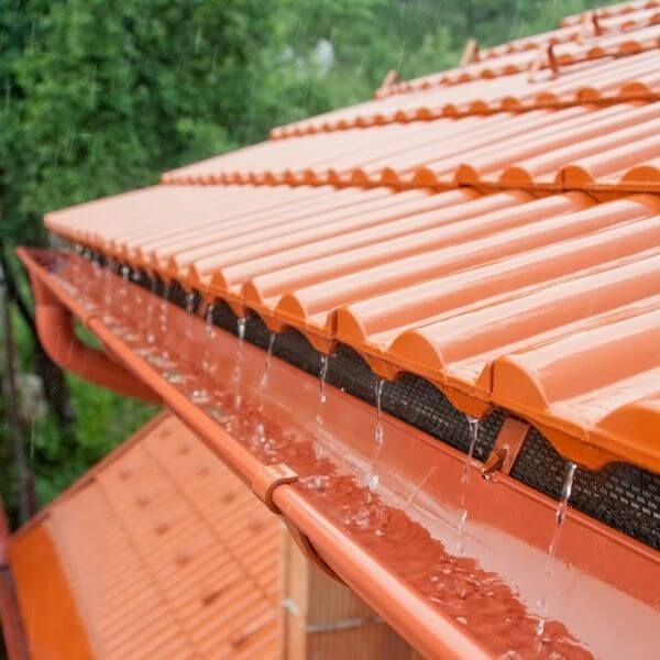 Newly replaced gutter system in action during heavy rainfall on a tiled roof in Western Sydney, installed by Sydney Gutter Guys Newly replaced gutter system in action during heavy rainfall on a tiled roof in Western Sydney, installed by Sydney Gutter Guys