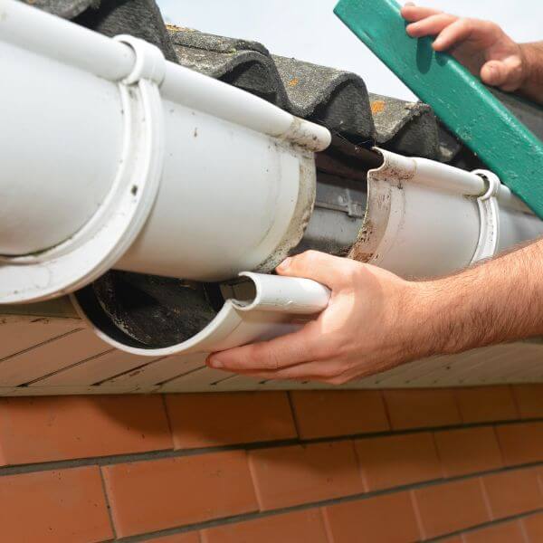 Sydney Gutter Guys performing gutter repairs on a residential home with damaged white PVC guttering Sydney Gutter Guys performing gutter repairs on a residential home with damaged white PVC guttering