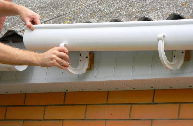 White PVC gutter replacement being installed on a single-storey home by Sydney Gutter Guys in Western Sydney White PVC gutter replacement being installed on a single-storey home by Sydney Gutter Guys in Western Sydney