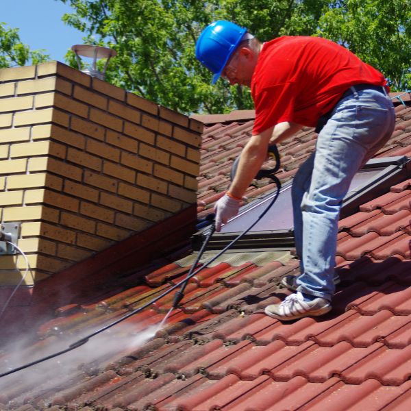 Roof cleaning in progress with pressure wash on tiled roof in Western Sydney by Sydney Gutter Guys Roof cleaning in progress with pressure wash on tiled roof in Western Sydney by Sydney Gutter Guys