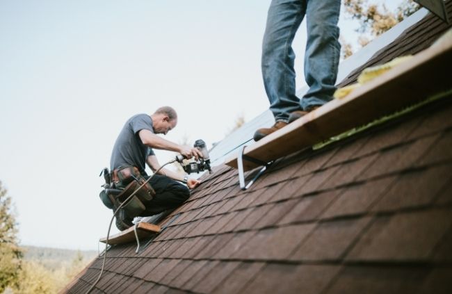 Sydney Gutter Guys carrying out roof restoration work on shingle roof Sydney Gutter Guys carrying out roof restoration work on shingle roof