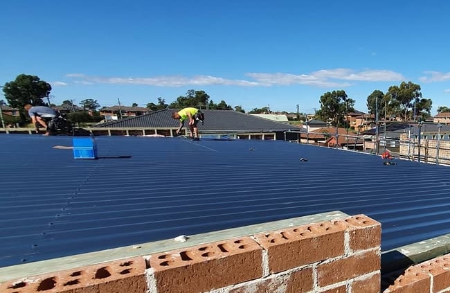 Sydney Gutter Guys carrying out reroofing on a residential home in Western Sydney.